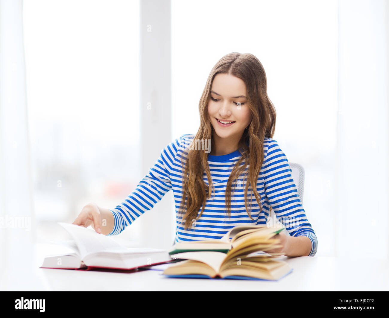happy smiling student girl with books Stock Photo - Alamy