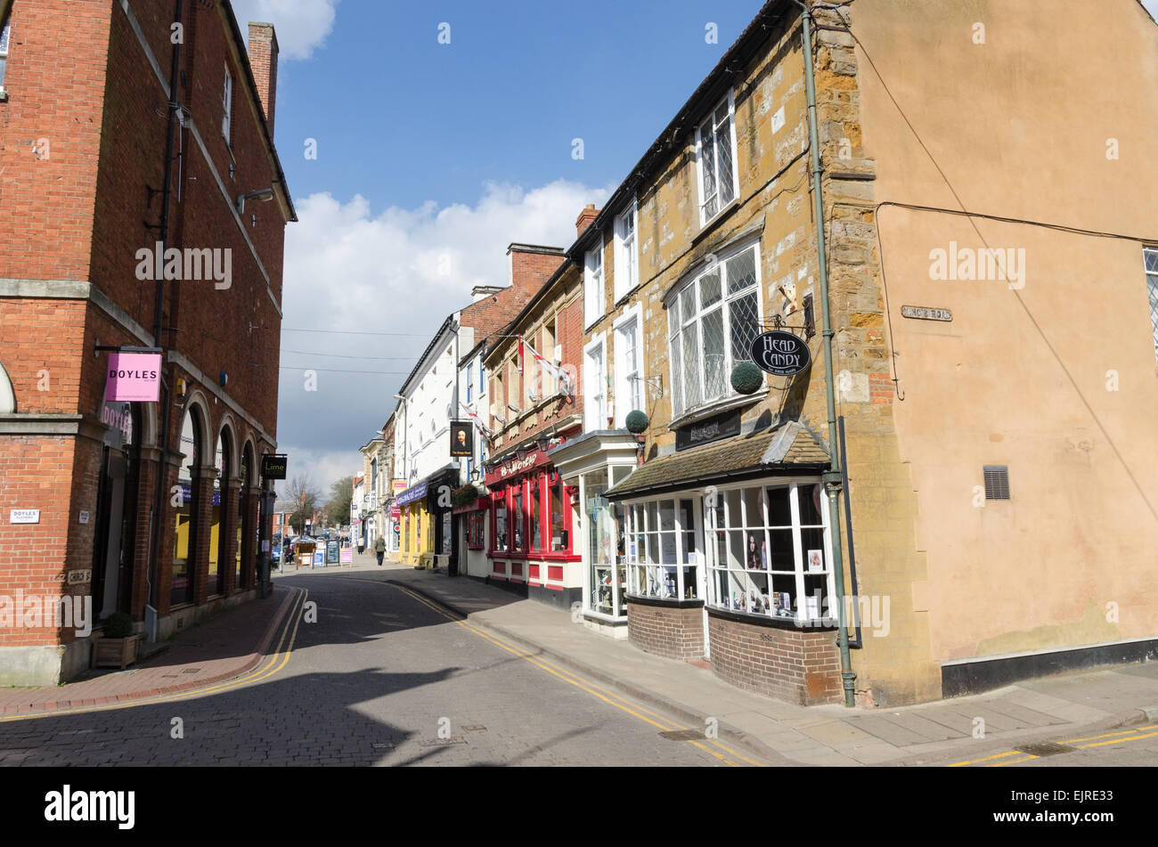 Shops and restaurants in Church Street the Leicestershire town of Market Harborough Stock Photo