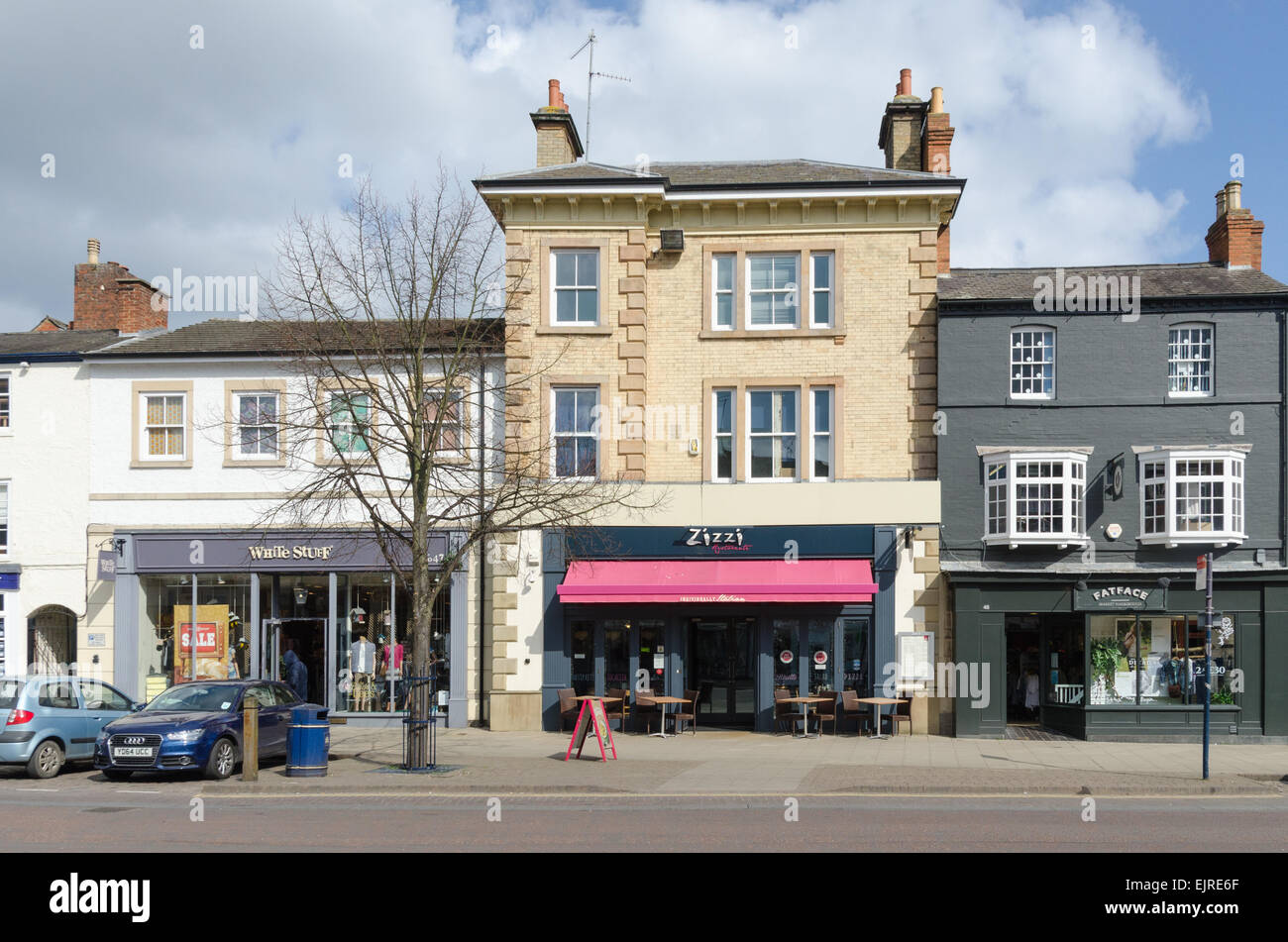 Shops and restaurants lining the High Street in Market Harborough Stock