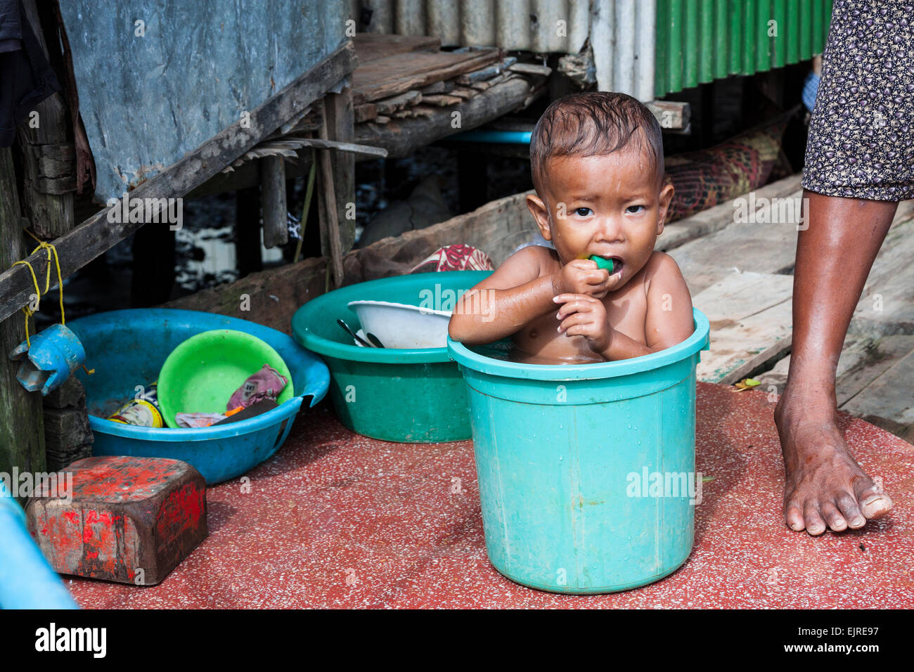 Image result for child be bath in street in cambodia