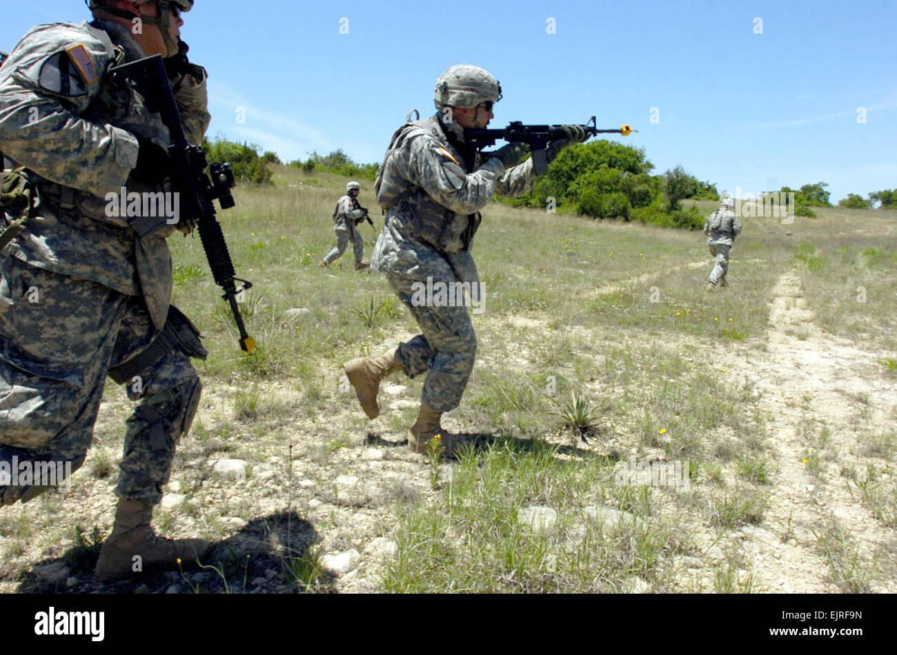 Spc. Alexis Harrison, 2nd Brigade Combat Team, 1st Cavalry Division Public Affairs May 16, 2008  Soldiers from Troop B, 4th Squadron, 9th Cavalry Regiment, 2nd Brigade Combat Team, 1st Cavalry Division, rush a simulated enemy hideout during a situational training exercise May 8. Stock Photo