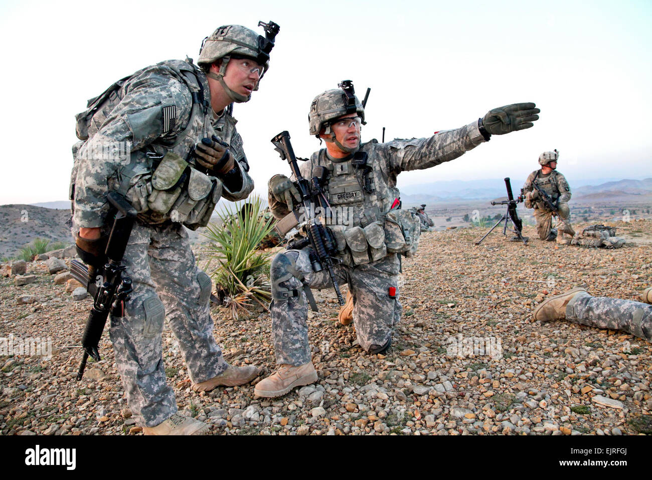 U.S. Army 1st Lt. Nicholas Gregory, kneeling, and Sgt. 1st Class
