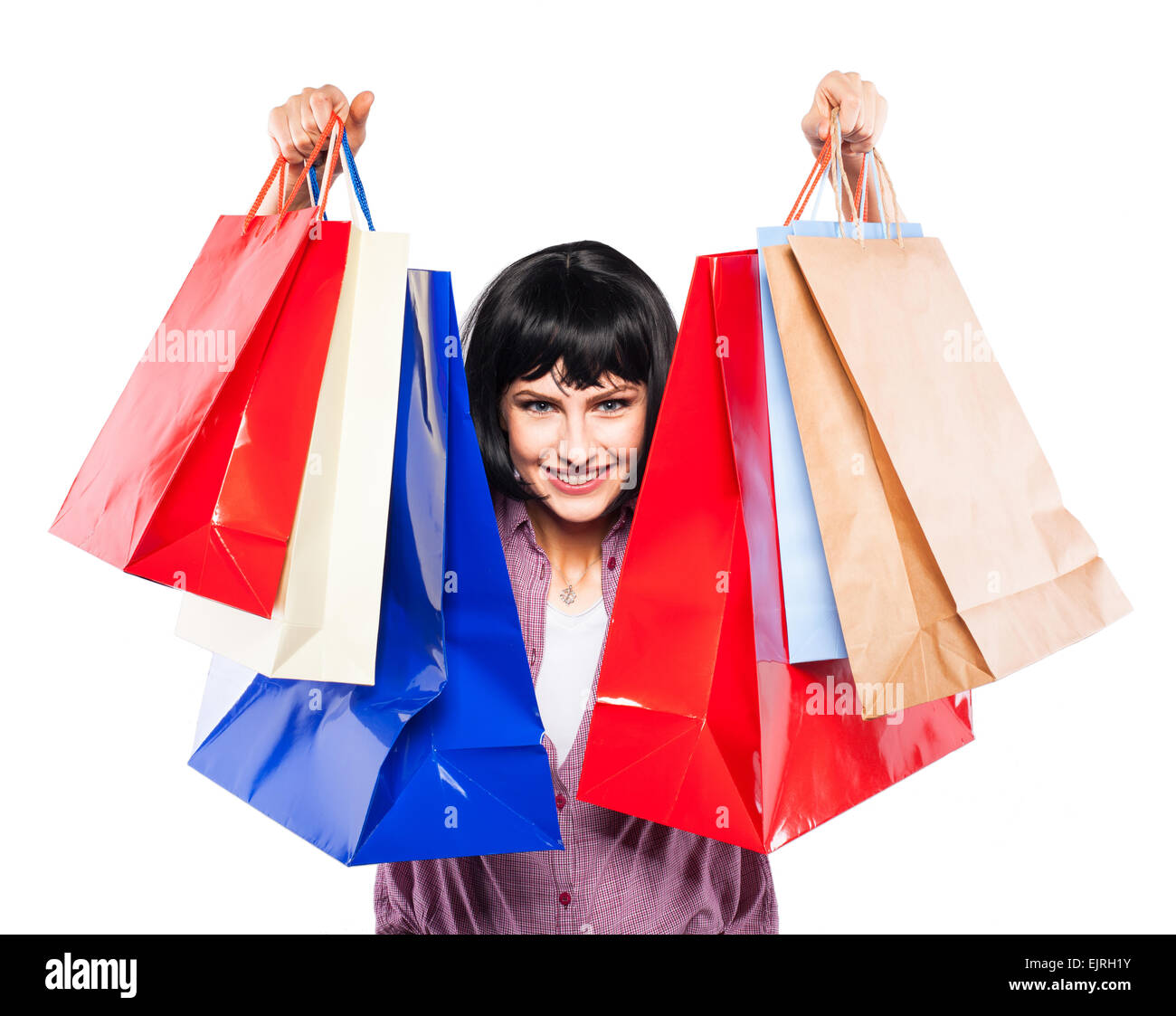 happy young woman smiling and showing her shopping bags Stock Photo - Alamy
