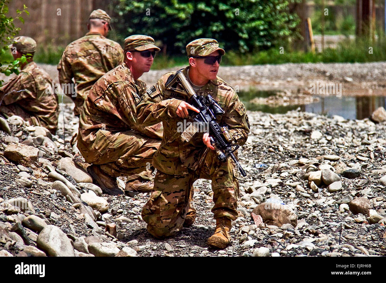 Soldiers with 2nd Battalion, 506th Infantry Regiment, 4th Brigade Combat Team, 101st Airborne Division Air Assault, show members of the Afghan Uniformed Police on how to pull security during a tactical training class on Aug. 15, 2013 at Forward Operating Base Salerno, Afghanistan.  Sgt. Justin A. Moeller, 4th Brigade Combat Team Public Affairs Stock Photo