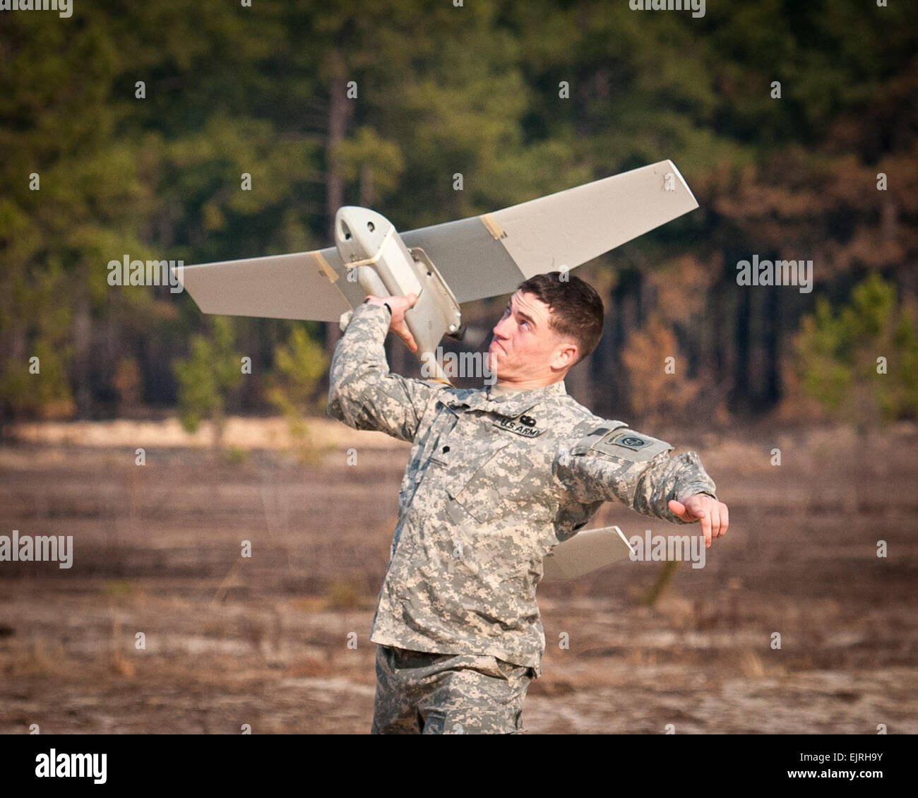 Spc. Corey Deer, a unmanned aerial vehicle operator with 1st Battalion, 504th Parachute Infantry Regiment, launches a Raven during a UAV refresher course Feb. 5, 2013, at Fort Bragg, N.C.  His battalion is part of the 82nd Airborne Division’s 1st Brigade Combat Team.  Sgt. Michael J. MacLeod Stock Photo