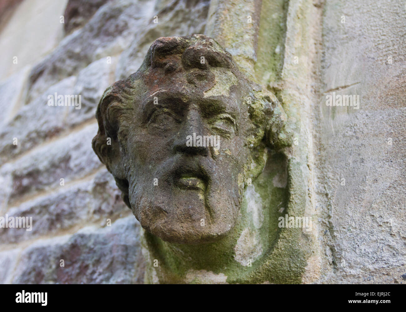 Carved Head on the Outside of St John's C.E. Church in the Village of Silverdale, Lancashire England UK Stock Photo