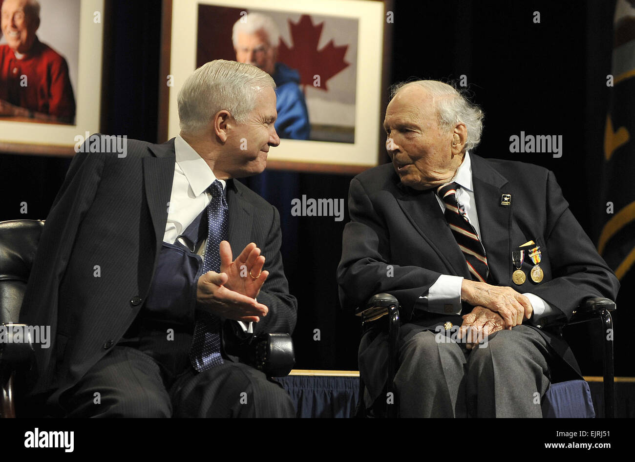 Secretary of Defense Robert M. Gates, left, talks with WWI veteran Frank Buckles during a dedication ceremony for the unveiling of portraits of WWI veterans in the Pentagon March 6, 2008.  Cherie A. Thurlby. Stock Photo