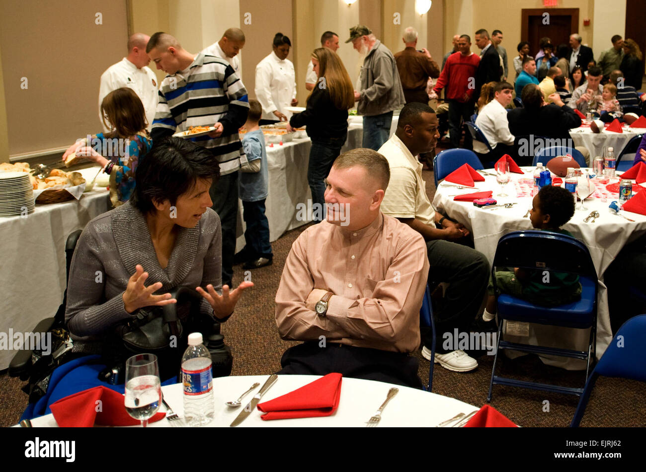 U.S. Army Staff Sgt. Liliana Caparo shares her observations of Walter Reed and the Veteran Affairs program with Vice Chairman of the Joint Chiefs of Staff Marine Gen. James Cartwright during a Valentines luncheon at Marine Barracks, Washington, D.C., Feb. 16, 2008. The luncheon, hosted by retired U.S. Marine Corps Gen. Peter Pace and his wife, Lynne, and supported by the USO is in honor of wounded warriors and their families.  Staff Sgt. D. Myles Cullen, U.S. Air Force. Stock Photo