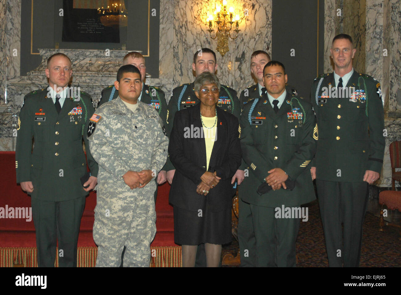 From back left, U.S. Army Staff Sgts. Shawn McGuire, Jon M. Hilliard, David Plush, Steven Peters, Spc. Gildardo Cebreros, Washington State Sen. Rosa Franklin, Sgt. 1st Class Ismael Iban-Cordero and Col. David Funk, commander of 3rd Battalion, 2nd Stryker Brigade Combat Team, gather in Washington, D.C., Feb. 1, 2008, after the Senate Resolution is read on the Senate floor for the Silver Star recipients.  Colleen J. Larson Released Stock Photo