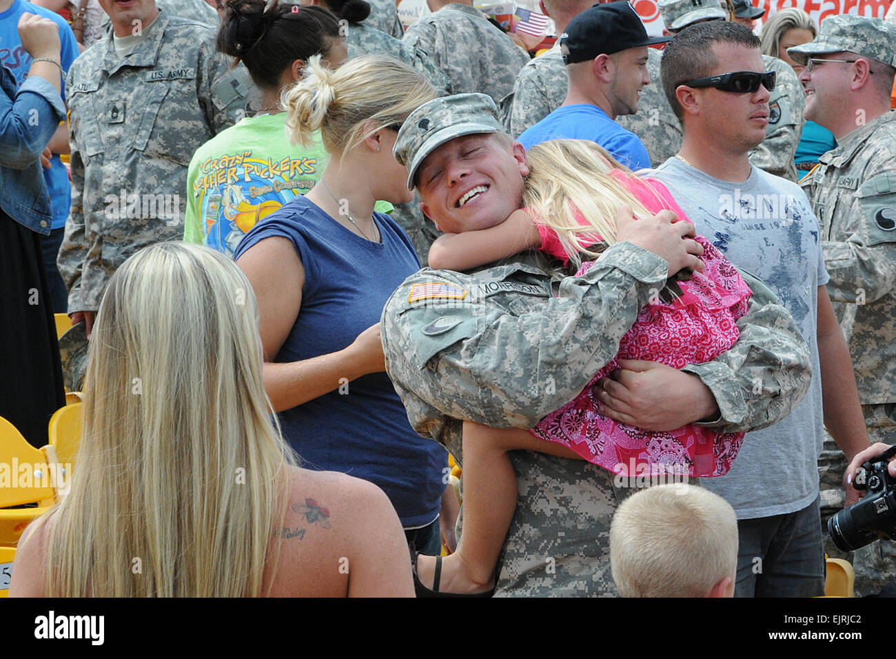 Spc. Daniel Morrison of the 1204th Aviation Support Battalion greets his family during the unit's welcome home ceremony at the Florence Freedom Baseball staudium in Florence, Ky., Aug. 18, 2012. The 1204th deployed last August to the Persian Gulf region in support of Operation New Dawn. Kentucky National Guard photo by Sgt. Scott Raymond Stock Photo