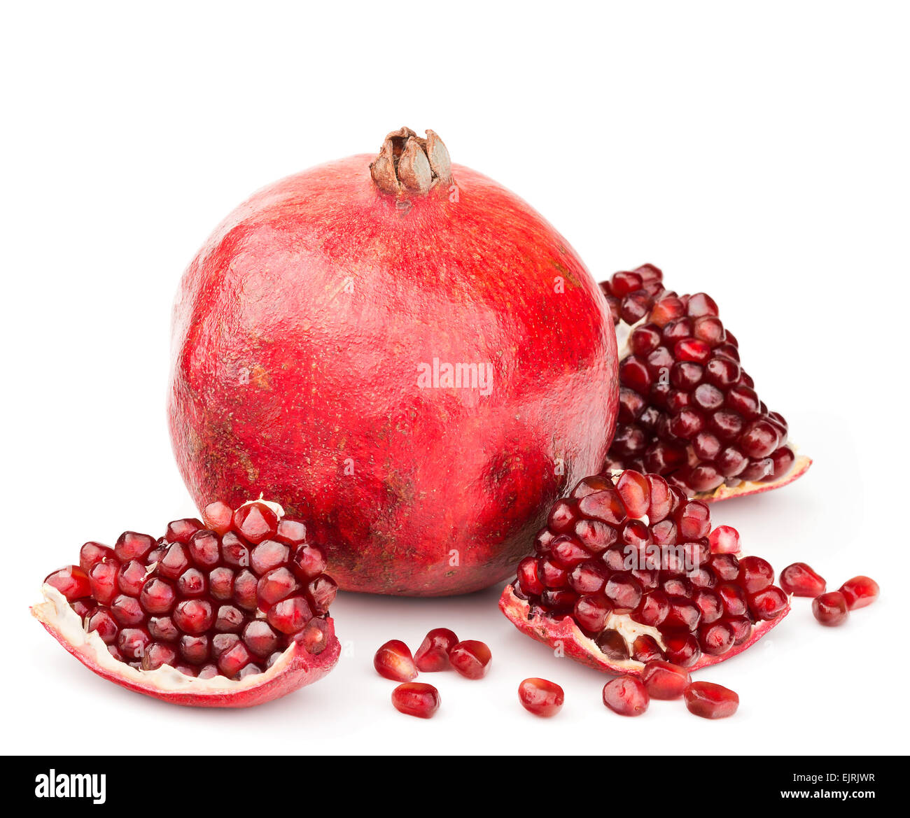 pomegranate with pieces and grains isolated Stock Photo