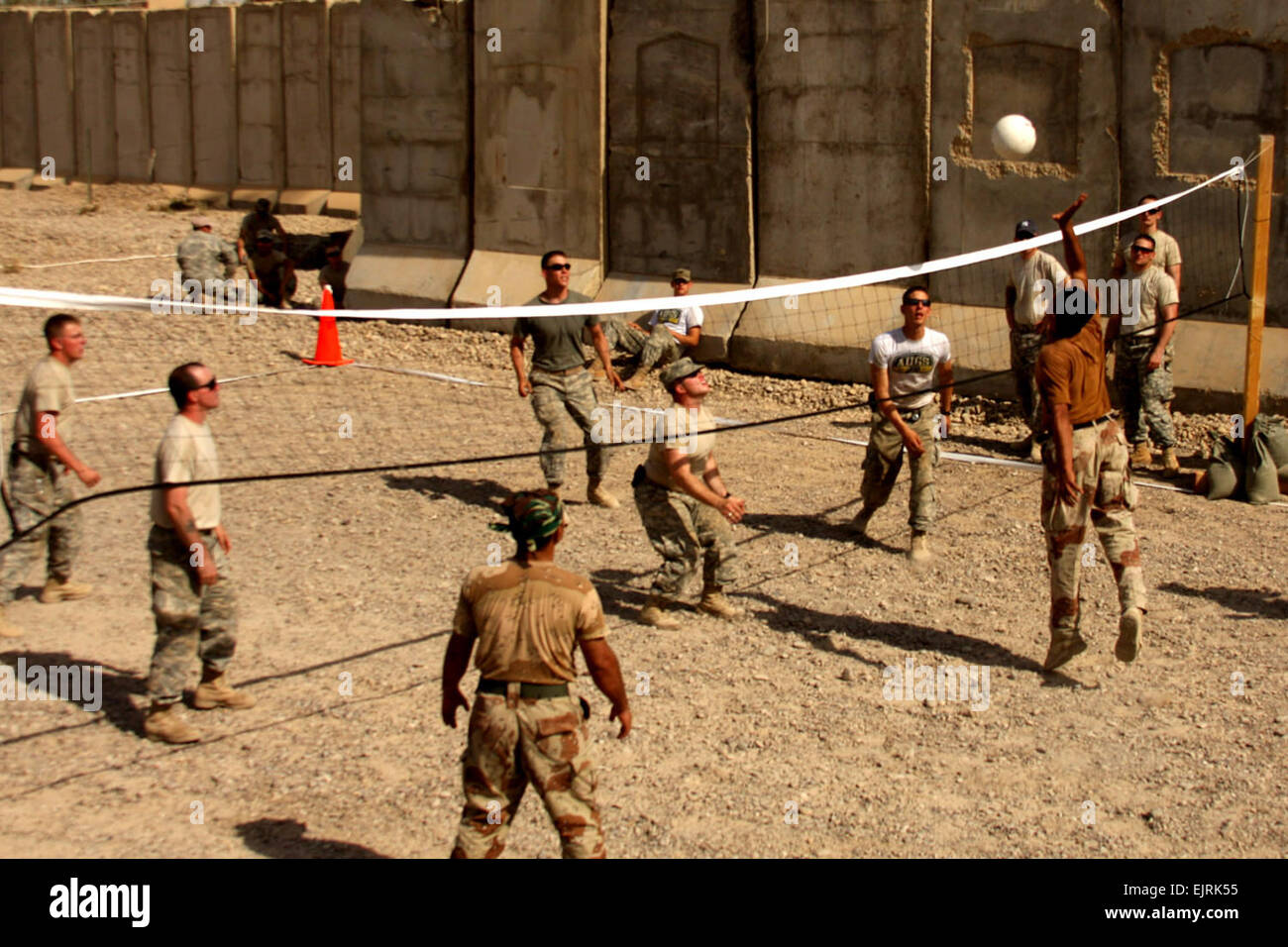 Iraqi Army soldiers from 2nd Battalion, 31st Brigade, 8th Infantry Division, compete against U.S. Weapons Platoon, Company B, 1st Battalion, 27th Infantry Regiment , 2nd Stryker Brigade Combat Team, Multi-National Division – Baghdad, in a volleyball tournament during the Borzoi Squad Competition at Joint Security Station Sheik Amir, northwest of Baghdad, July 4, 2008.  Pfc. Lyndsey R. Dransfield Stock Photo