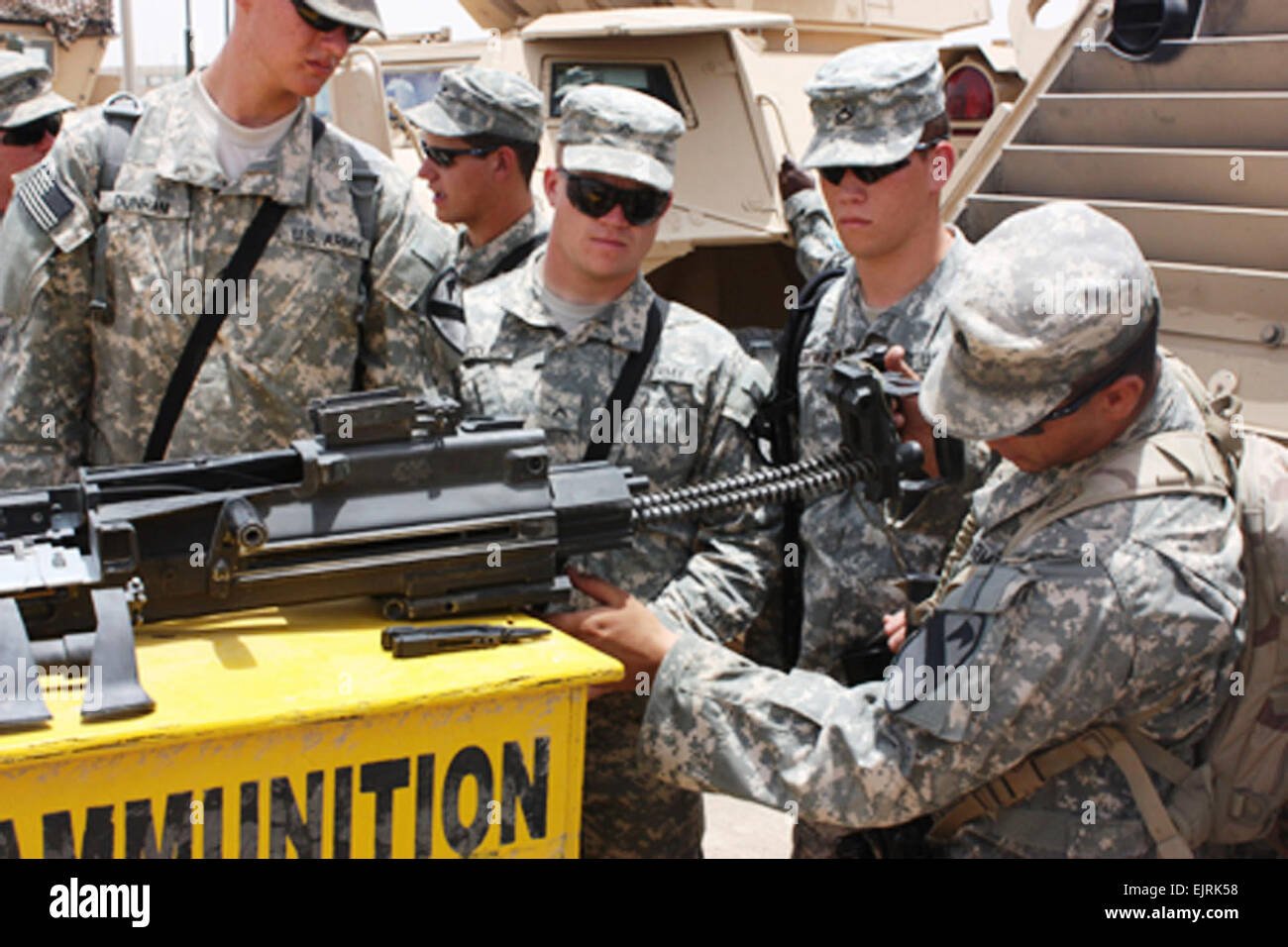 Soldiers in Staff Sgt. Steven Roode’s squad assemble a M2 - .50 caliber weapon during a tactical training class in Tallil, Iraq, June 24. The Soldiers are assigned to Troop A, 2nd Squadron, 7th Cavalry Regiment, 4th Brigade Combat Team, 1st Cavalry Division.  Pfc. Terence Ewings, 4th BCT PAO, 1st Cav. Div.  see: www.defenselink.mil/news/newsarticle.aspx?id=50403  www.defenselink.mil/news/newsarticle.aspx?id=50403 Stock Photo