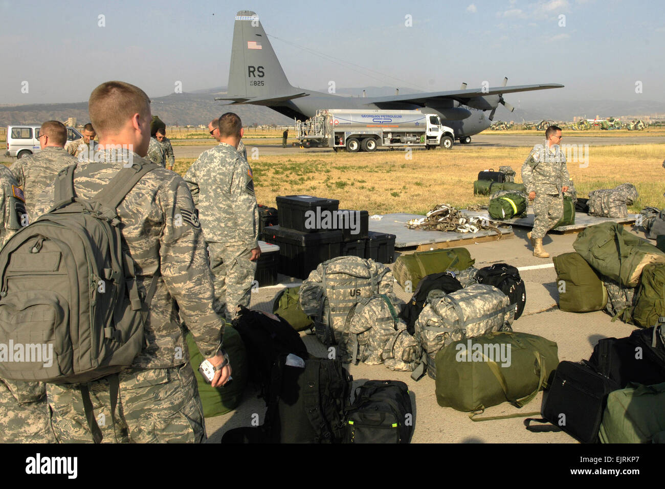 Soldiers and airmen from the 21st Theater Sustainment Command arrive on the flight line in Tbilisi, Georgia, Aug. 18. The 21st is part of European Command’s EUCOM Joint Humanitarian Assistance Assessment Team and are working closely with other elements of the federal government, international governments, aid agencies and the Republic of Georgia to help bring aid to the Georgian people.   Air Force Staff Sgt. Ricky A. Bloom Stock Photo