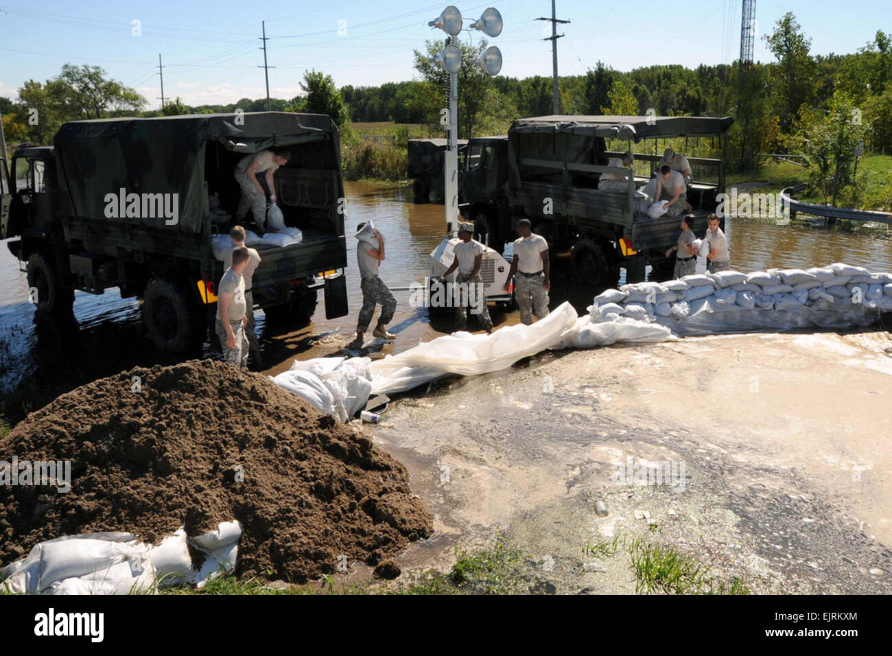 The remnants of Hurricane Ike that smashed the Texas coastline on September 12, 2008, dumped over 10 inches of rain on several Northwestern Indiana counties causing lake, rivers, tributaries and levies to spill over their banks and cause massive flooding.  On September 16th, Members of the Indiana Army National Guard 113th Engineer Battalion tossed thousands of sand bags on to failing levies in Gary, Indiana, to help shore them up and stop further flooding. Stock Photo