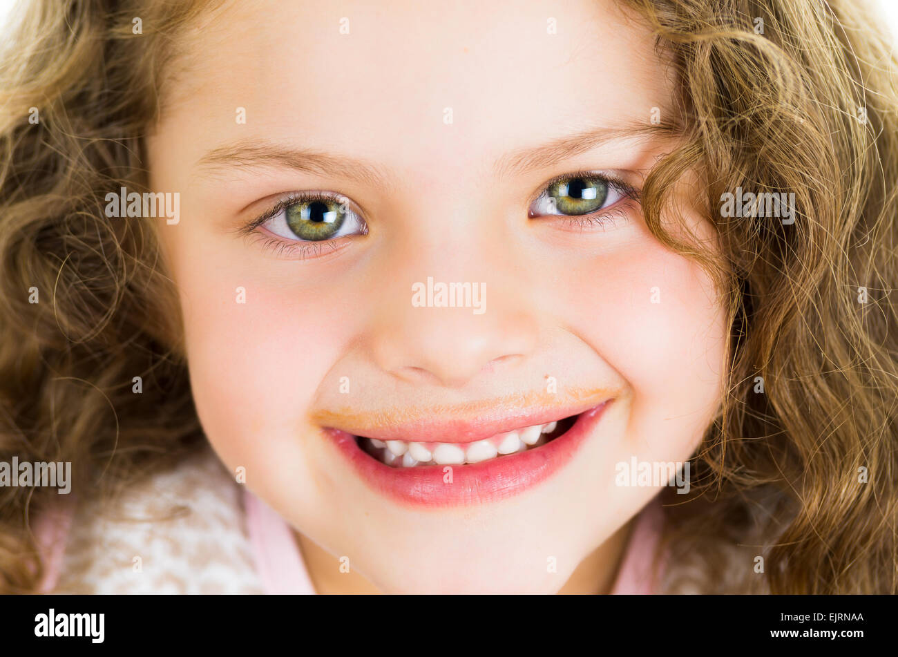 Cute little preschooler girl with chocolate milk mustache Stock Photo