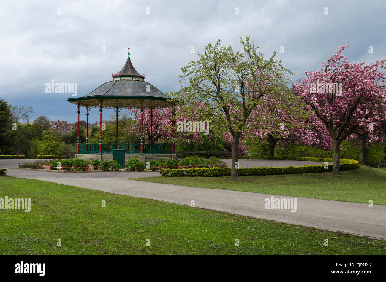 Traditional English, British band stand in a park with blossom trees
