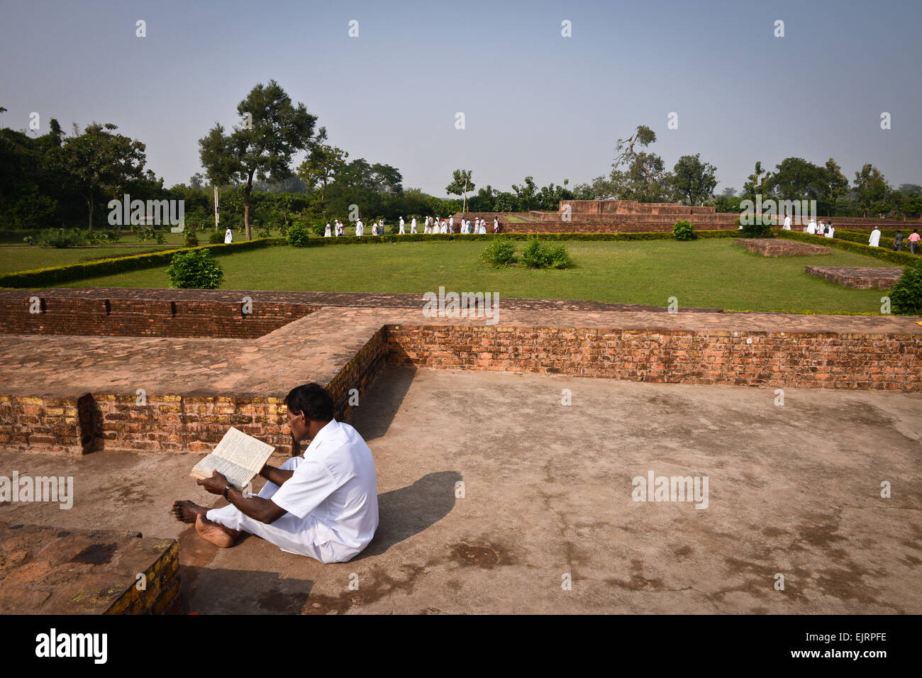 Pilgrim reading Buddhist scriptures at Sravasti Stock Photo