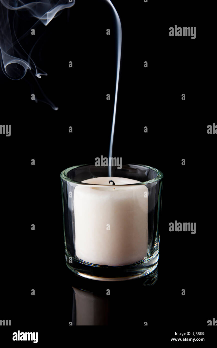 https://c8.alamy.com/comp/EJRR8G/smoke-rises-from-a-white-candle-that-has-just-been-blown-out-black-EJRR8G.jpg