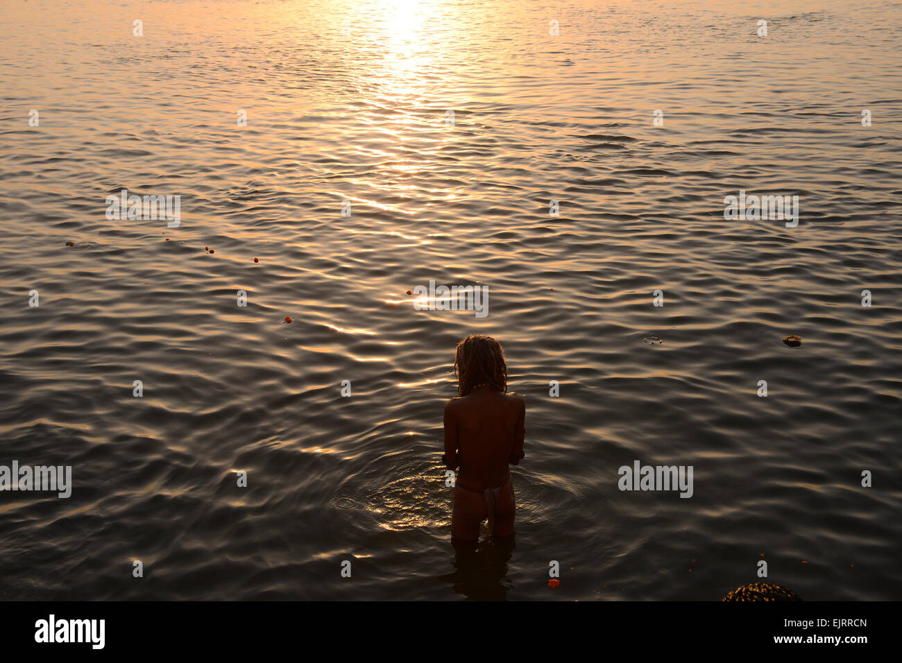 Holy performing a morning ritual in the Ganges. Stock Photo