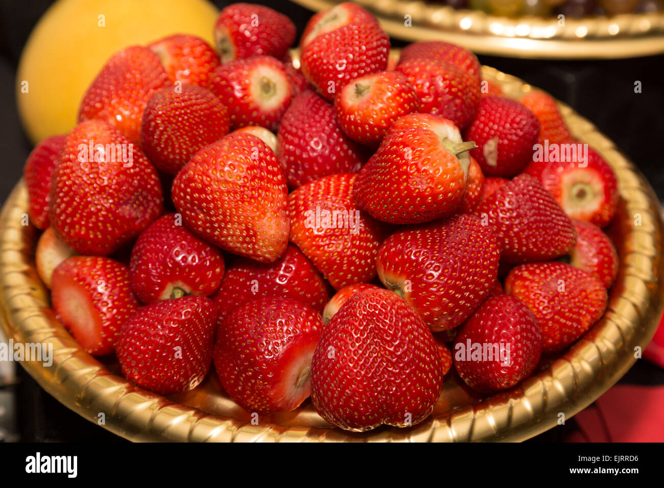 High view of lots of fresh juicy strawberries in a tub Stock Photo