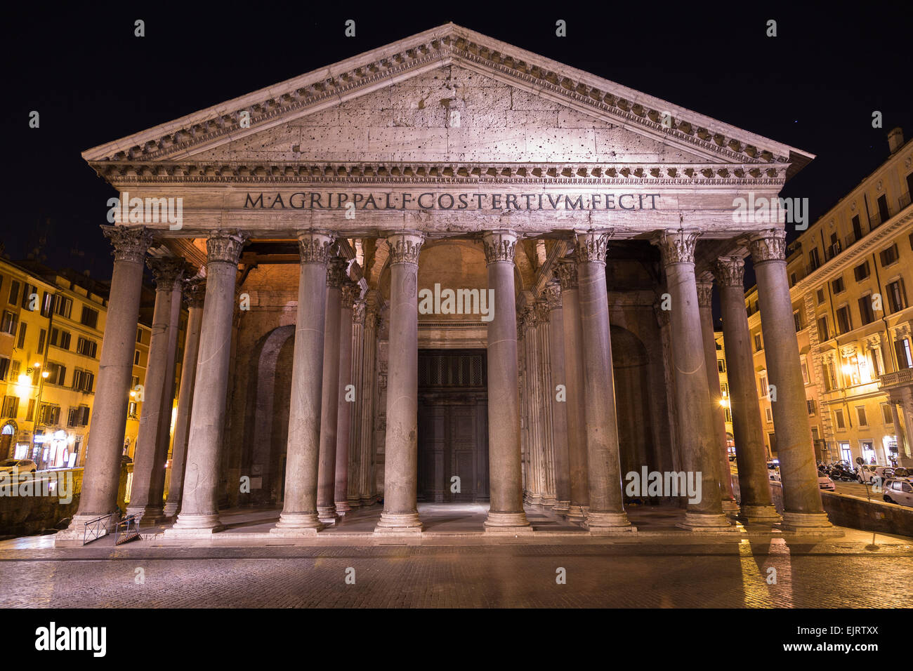 The outside of the Pantheon in Rome at Night. Showing part of the architecture and design Stock Photo
