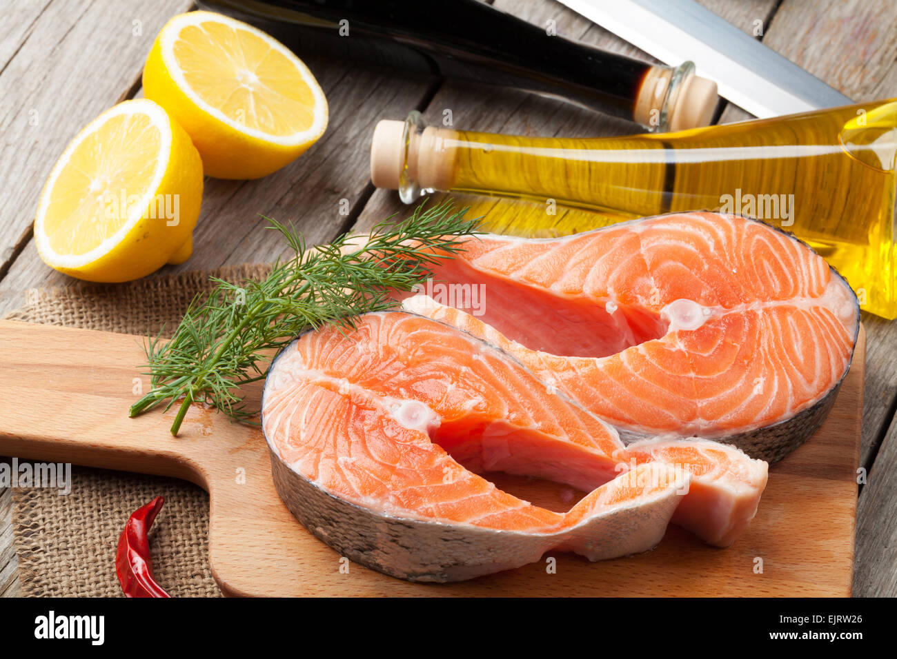 Salmon and spices on wooden table Stock Photo