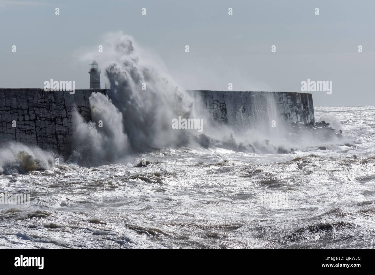 Huge waves crash over the harbour wall at Newhaven, East Sussex United Kingdom UK Stock Photo