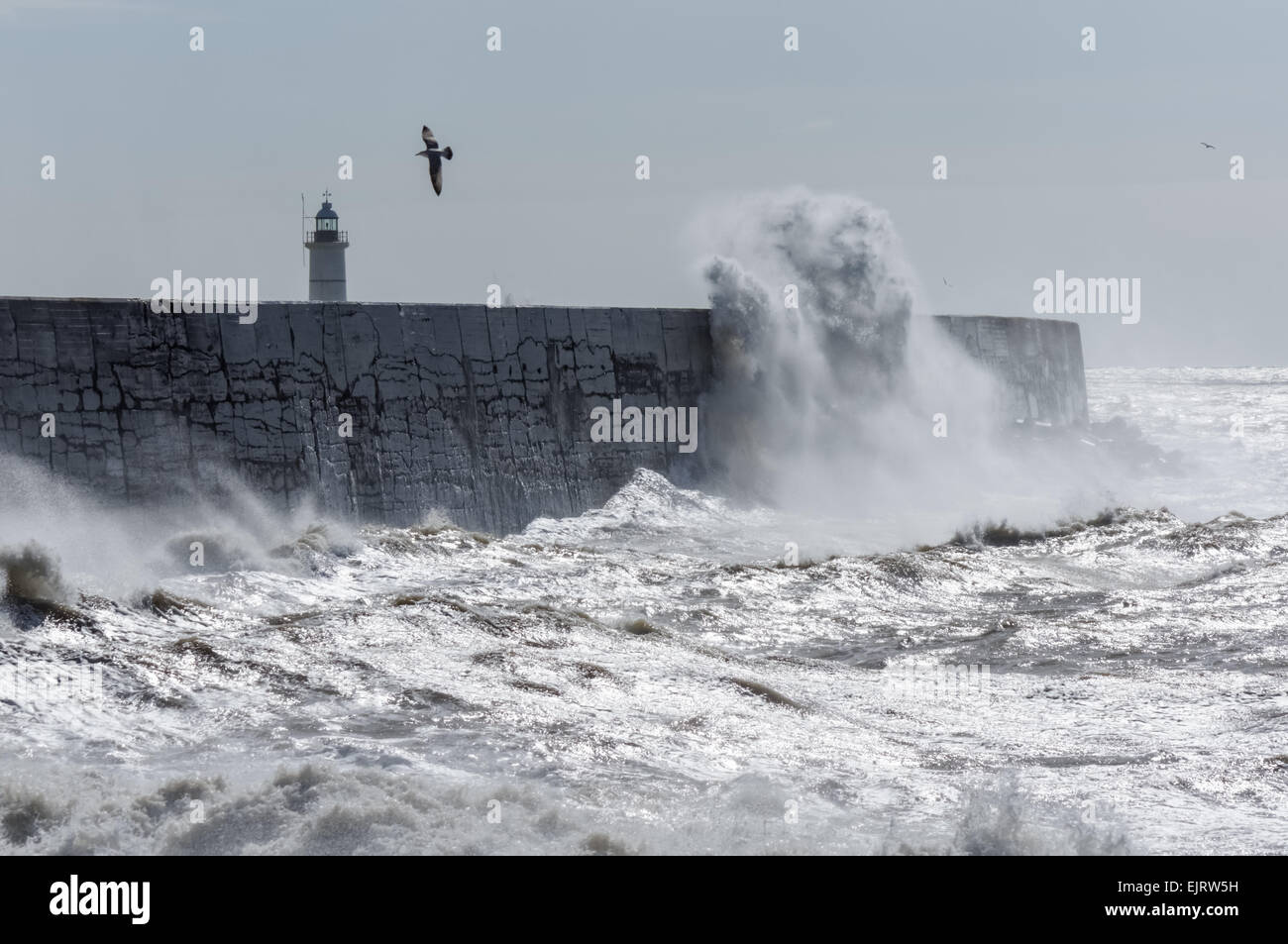 Huge waves crash over the harbour wall at Newhaven, East Sussex United Kingdom UK Stock Photo