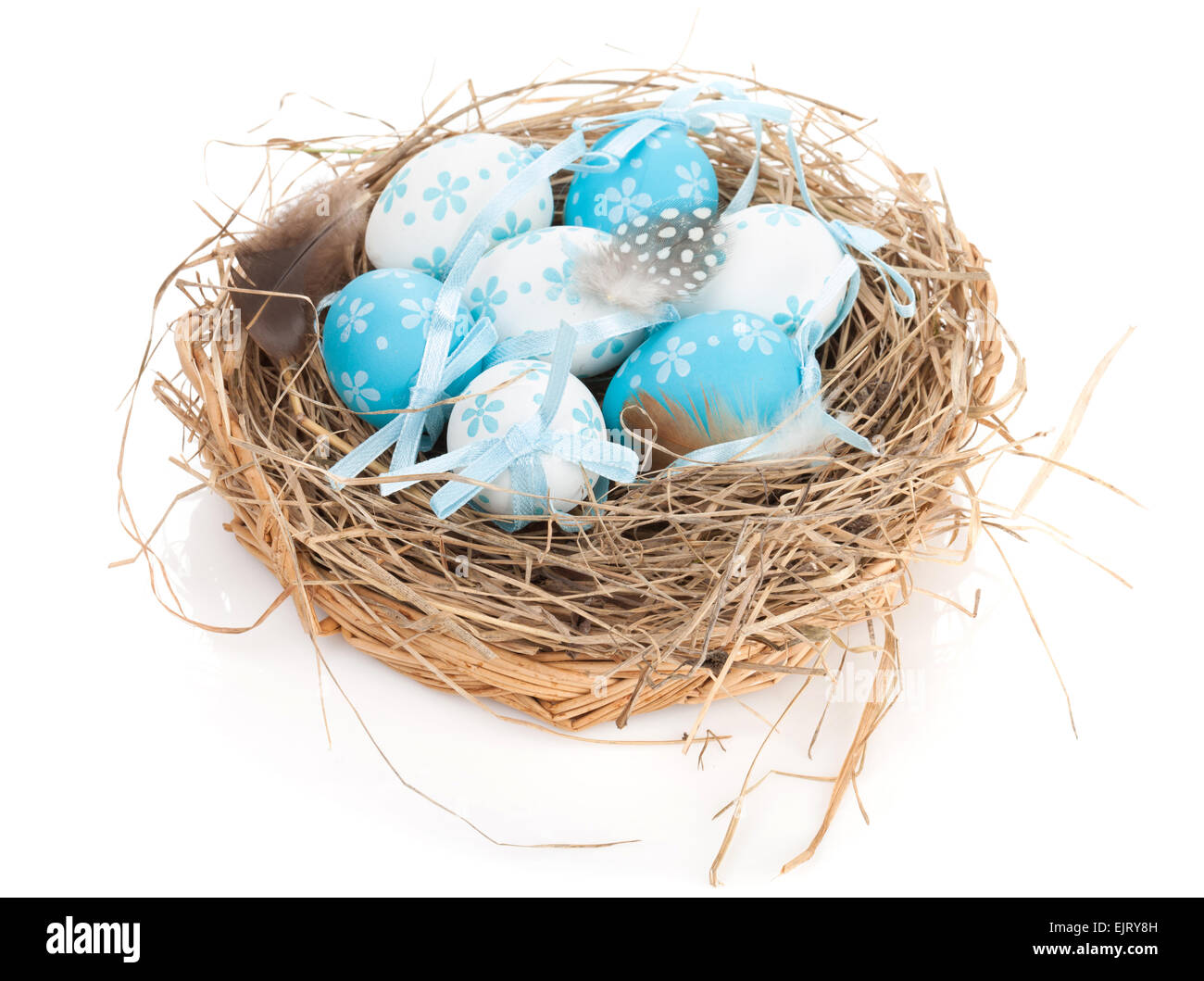 Easter eggs nest. Isolated on white background Stock Photo - Alamy