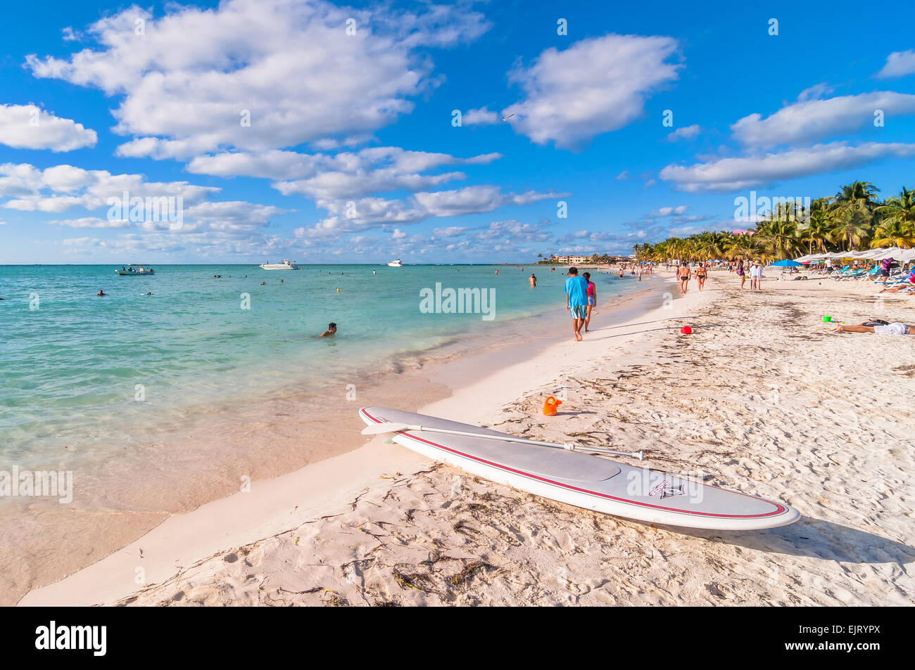 Isla Mujeres, Mexico - April 21, 2014: tourists enjoy tropical sea on famous Playa del Norte beach in Isla Mujeres, Mexico. Stock Photo