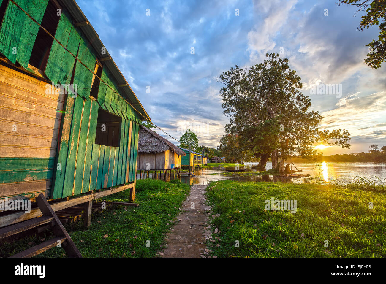 Sunset over the village of Santa Rita in the Amazon rainforest in Peru Stock Photo