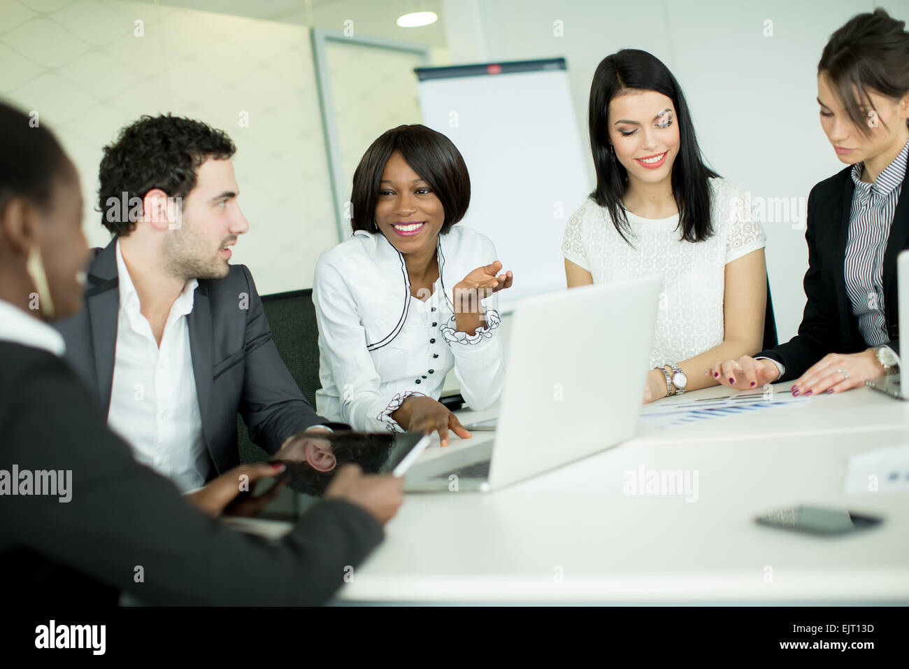 Young people working in the office Stock Photo - Alamy