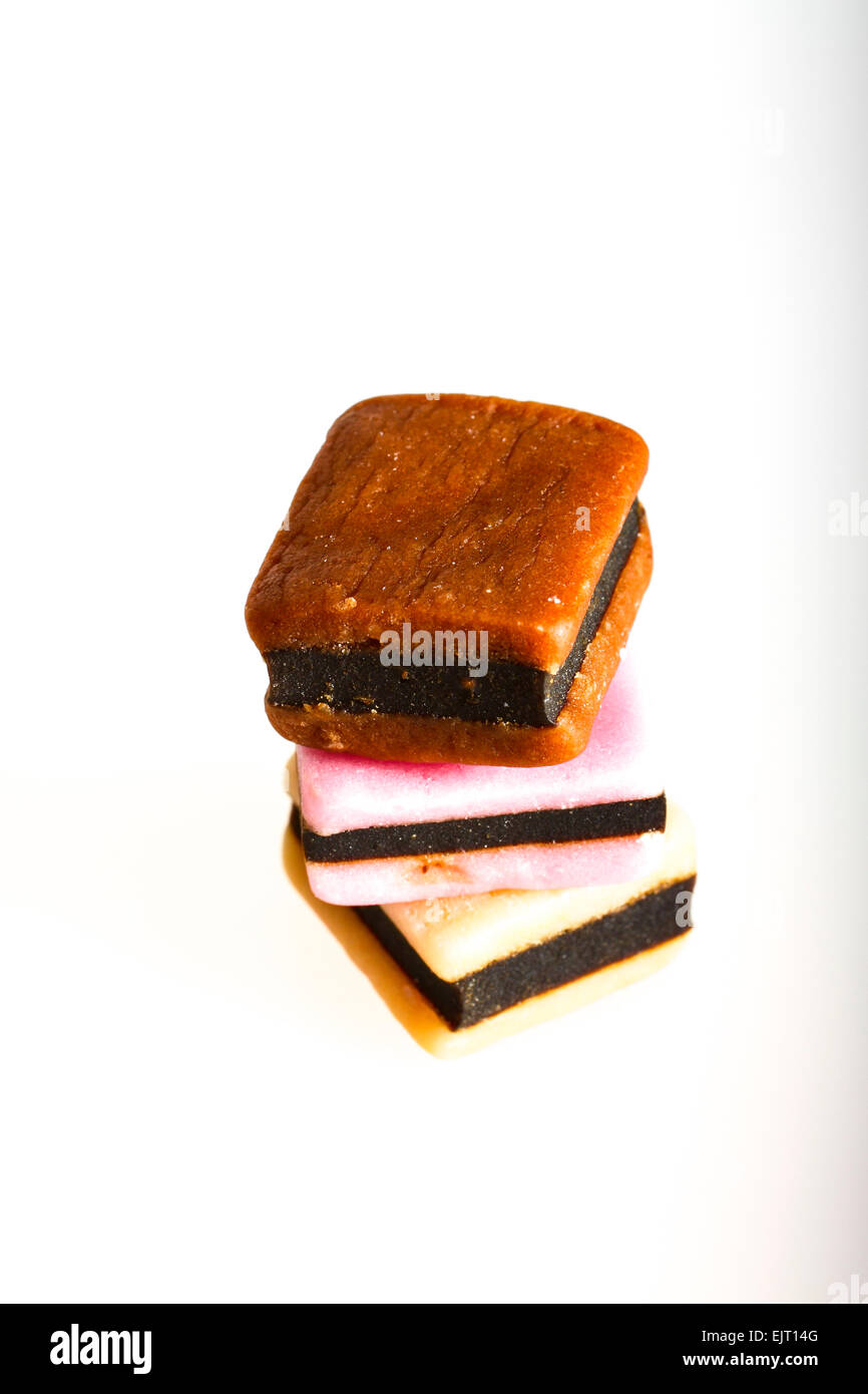Three liquorice allsorts on a white background Stock Photo Alamy