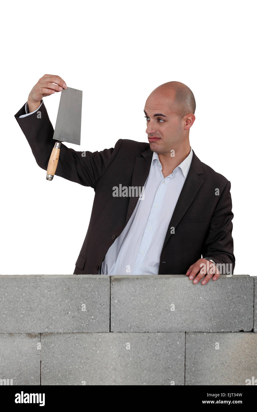 Man holding a trowel Stock Photo Alamy