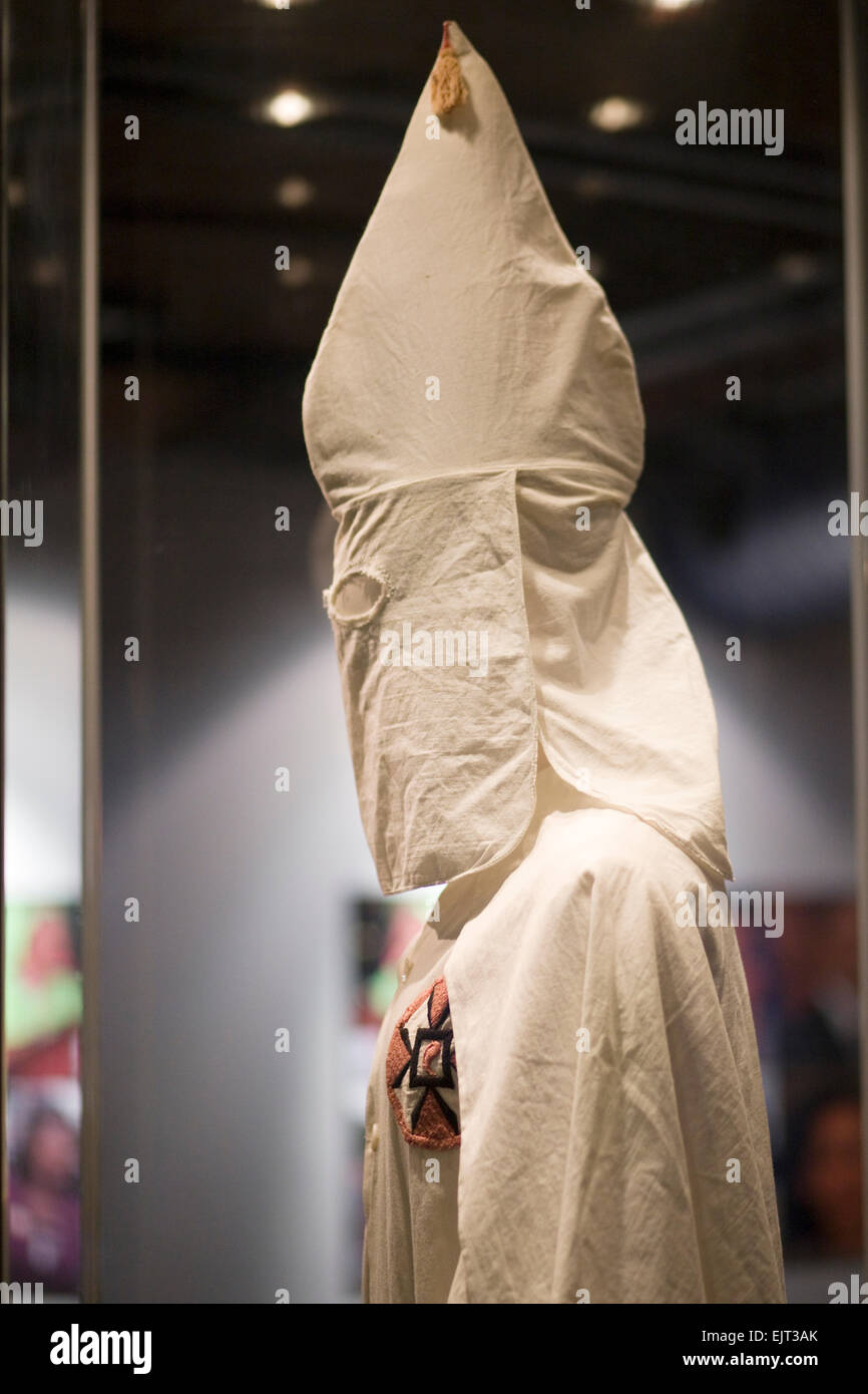 costume of the Ku Klux Klan encased in glass Stock Photo