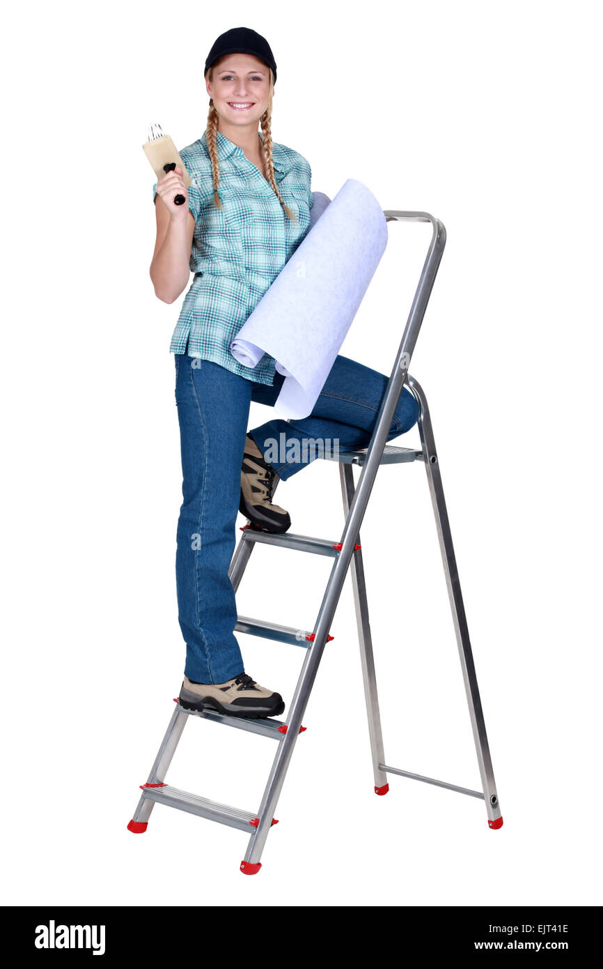 Women climbing a step ladder Stock Photo Alamy
