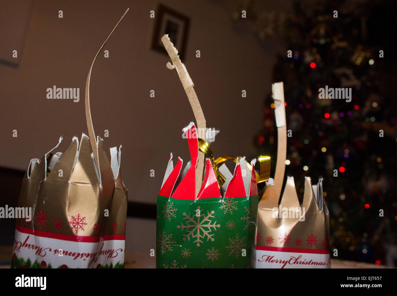 Pulled crackers showing the used snaps after a Christmas dinner on a