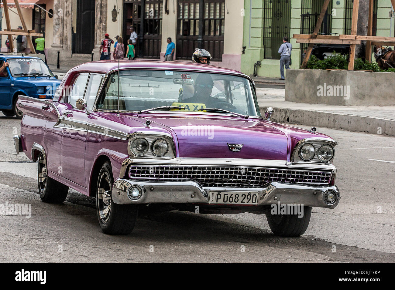 Old American purple car used as a taxi on the street in Old Havana in Cuba Stock Photo