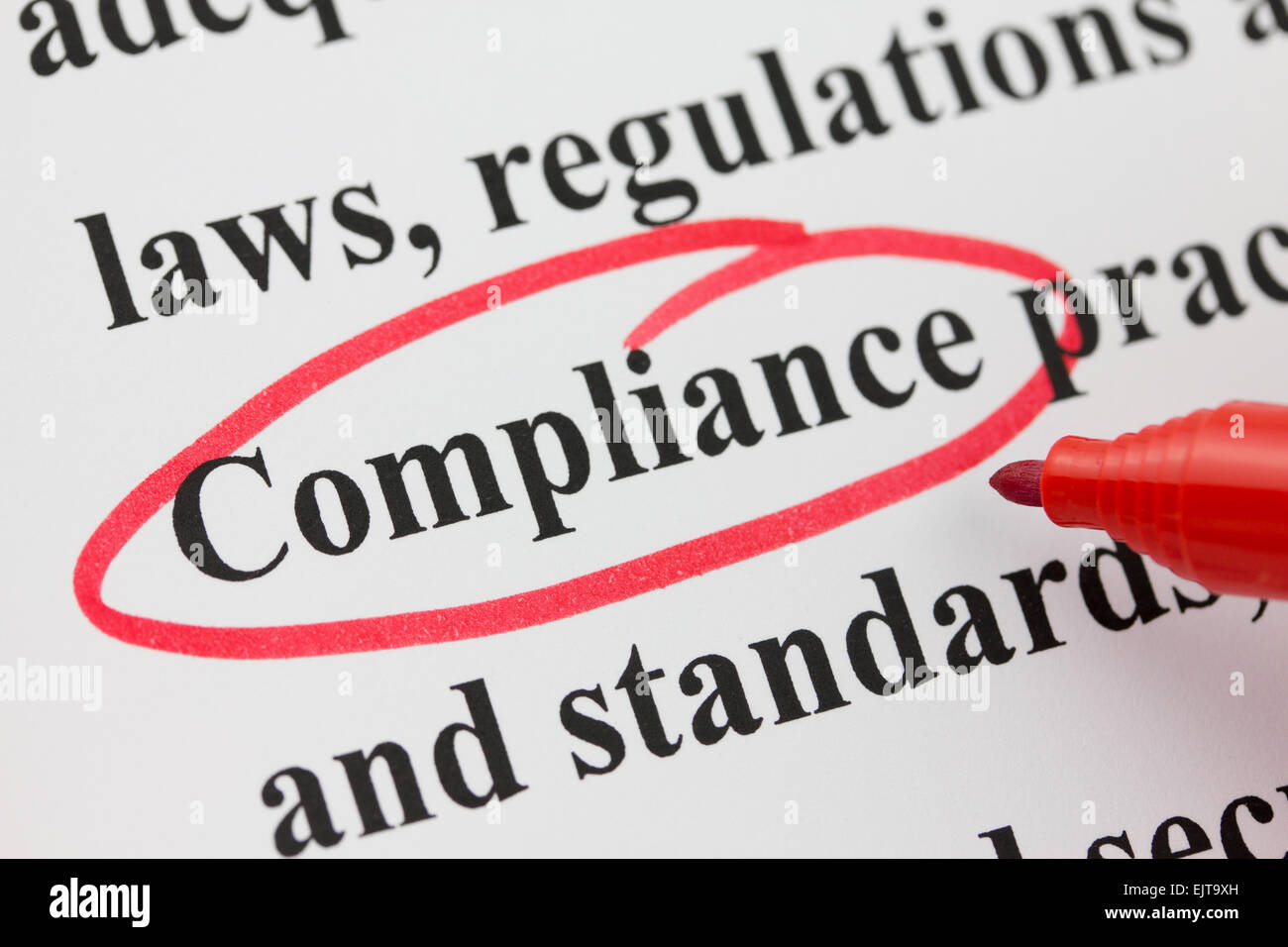 Word Compliance Circled in Red Pen Closeup Stock Photo