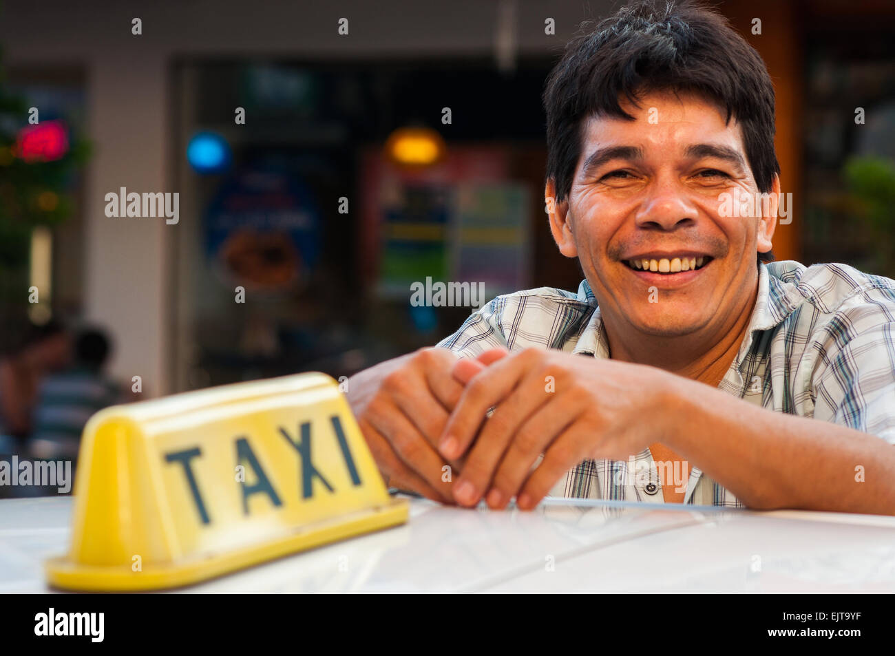 Taxi driver in Calle Estigarrabia, Encarnacion, Paraguay Stock Photo