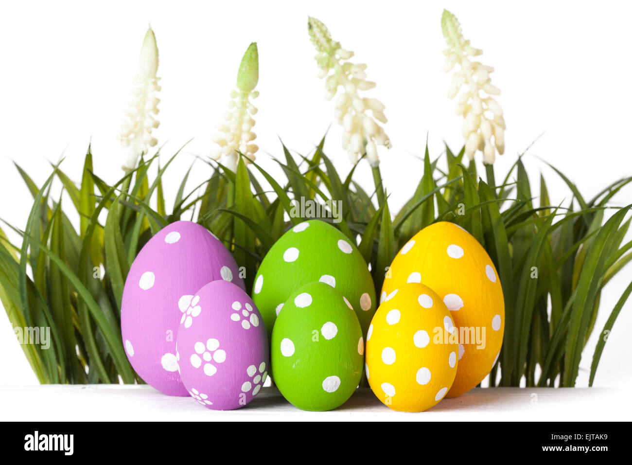 Easter eggs lying on the meadow Stock Photo