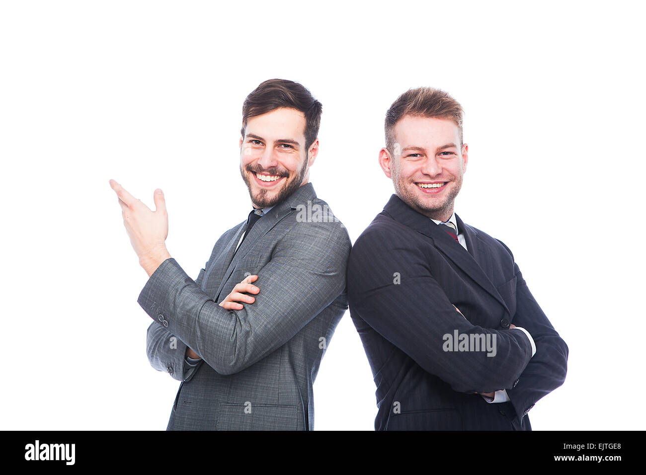 smiling businessmen back to back on white background Stock Photo - Alamy
