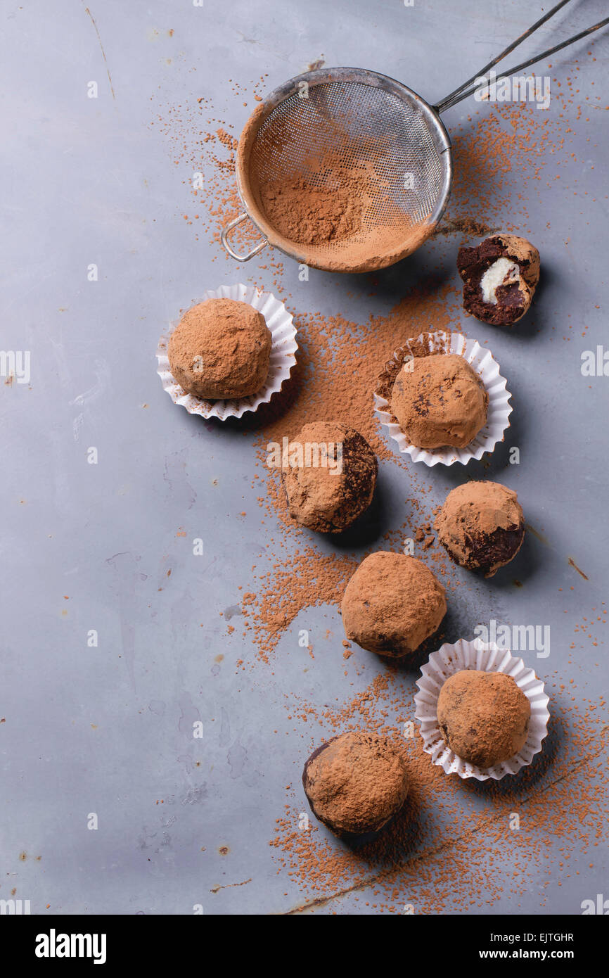 https://c8.alamy.com/comp/EJTGHR/homemade-chocolate-truffles-with-marzipan-and-cocoa-powder-over-gray-EJTGHR.jpg