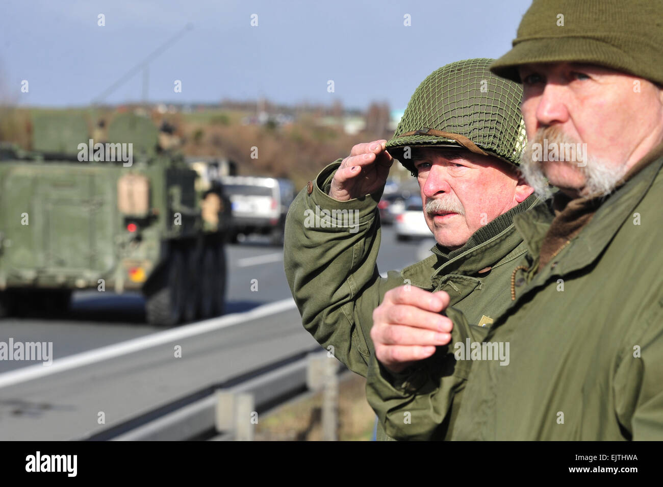 Prague, Czech Republic, 01st Apr, 2015. Hundreds of supporters including members of historical army club wait along the roads to greet the U.S. military convoy, near Pilsen, Czech Republic, April 1, 2015. The Convoy left the barracks in Prague-Ruzyne and heads for the Rozvadov-Waidhaus, west Bohemia, border with Germany. The troops continue to the Vilseck military base in Bavaria. Some 500 soldiers on around 115 armoured vehicles are crossing the Czech Republic during the 'Dragoon Ride' to demonstrate support for the allies' territories that feel threatened by the Russian aggression in Ukraine Stock Photo