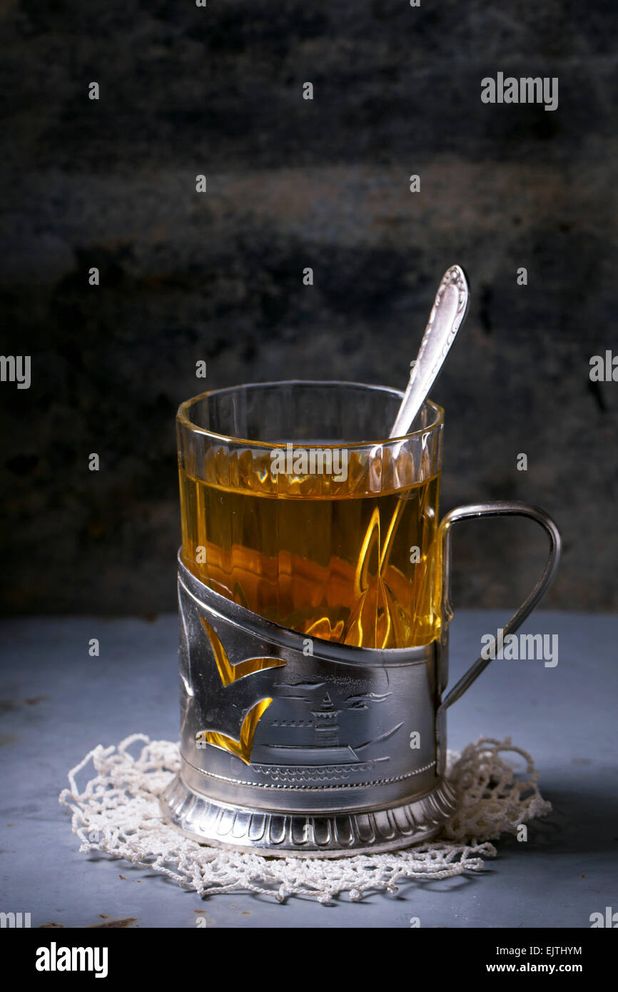 glass and metal tea cups