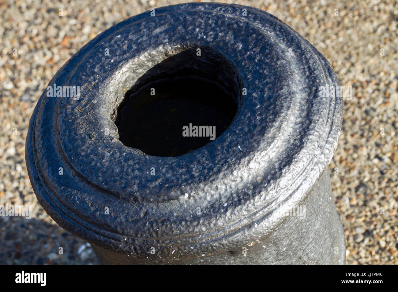 Mouth of naval cannon used as bollard, old docks, East India Dock Basin, London Stock Photo