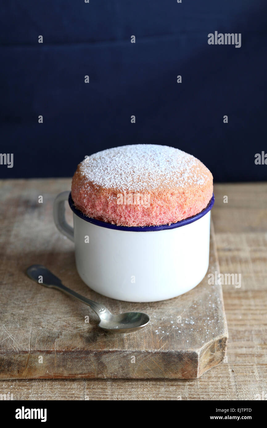 Strawberry souffle in enamel mug Stock Photo