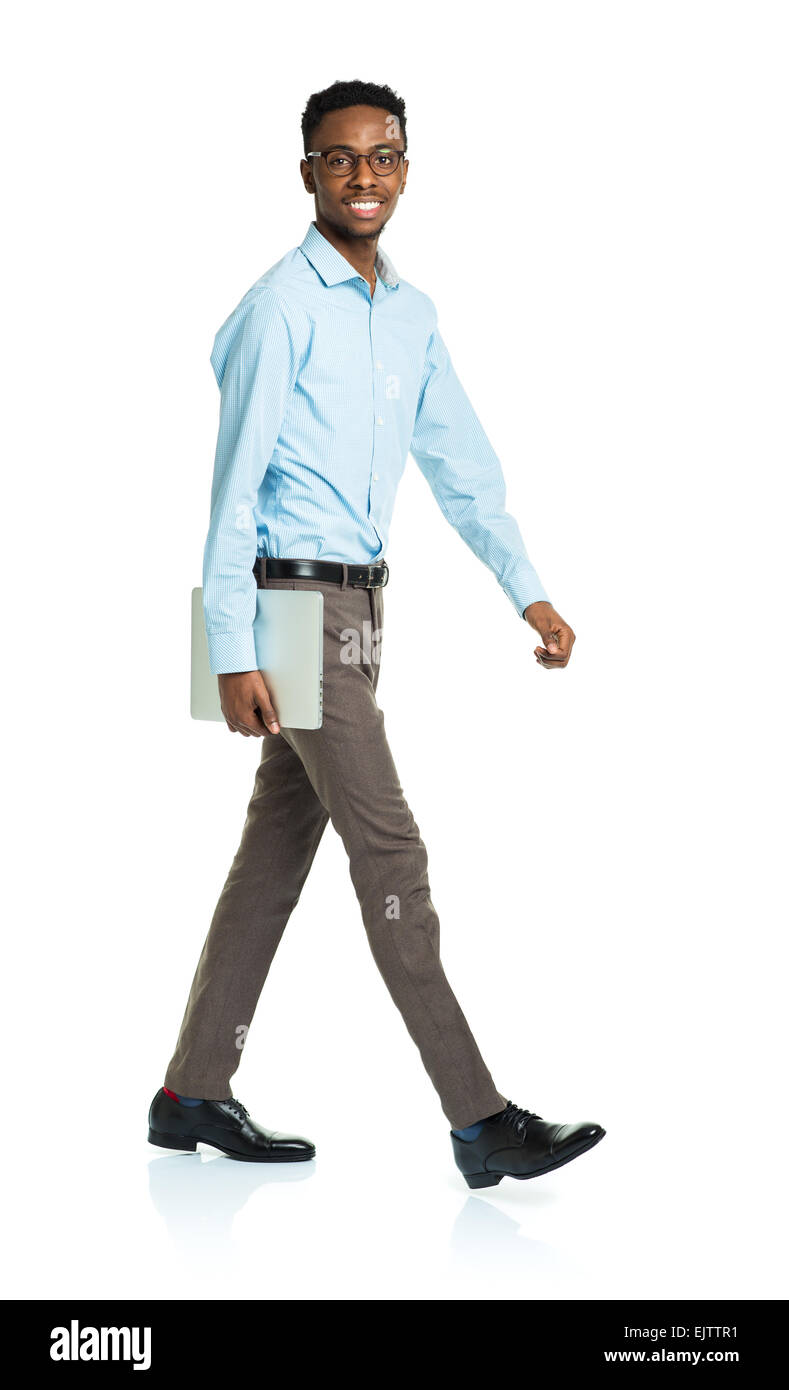 Happy african american college student with laptop standing on white background Stock Photo