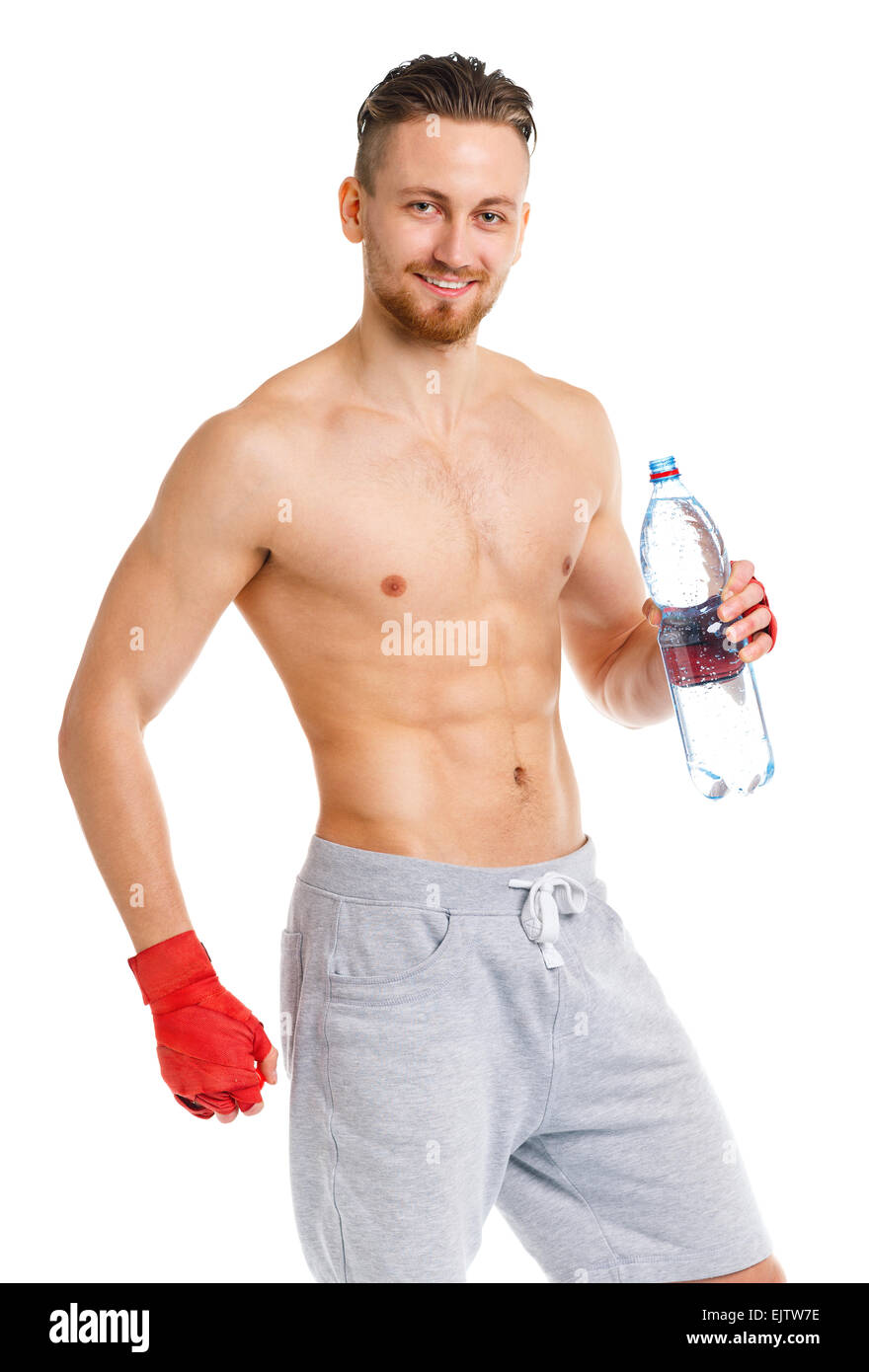 Athletic attractive man wearing boxing bandages with bottle of water on the white background Stock Photo